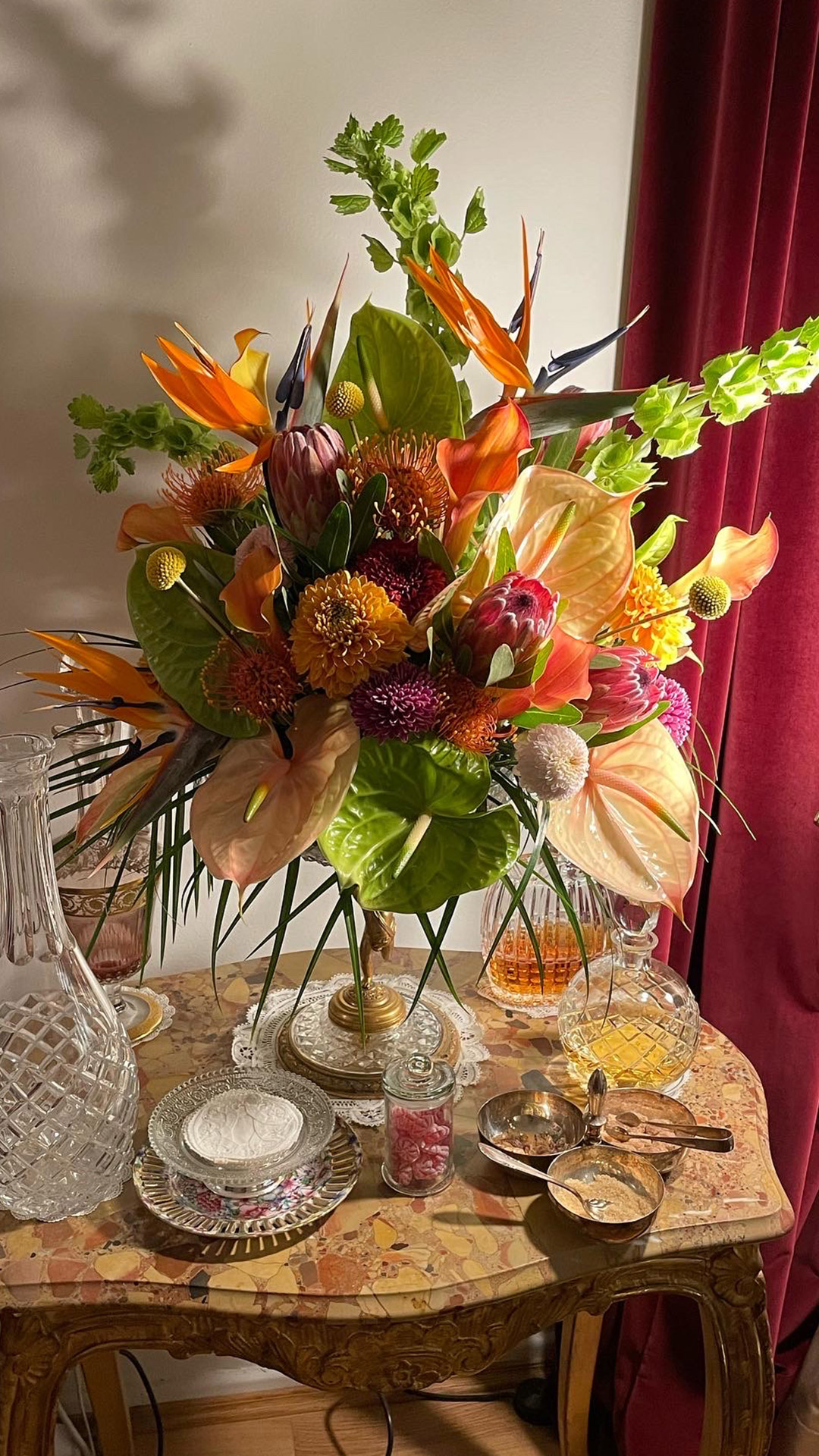 rare decanters and chrystal bowls with extravagant floral arrangements